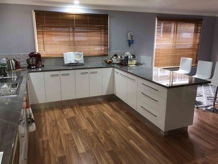 Grey & White Kitchen with Timber Flooring