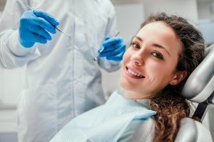 Woman Smiling During Dental Cleaning — Pinole, CA — Dalia E. Perez-Salinas, D.D.S.