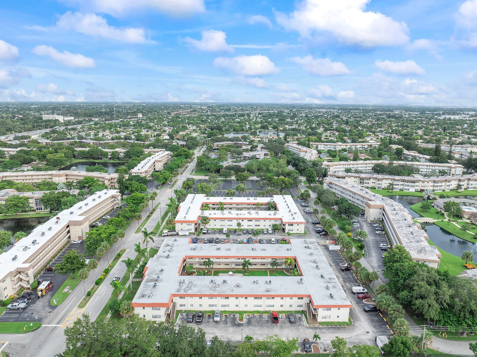 An aerial view of a large building in the middle of a city.