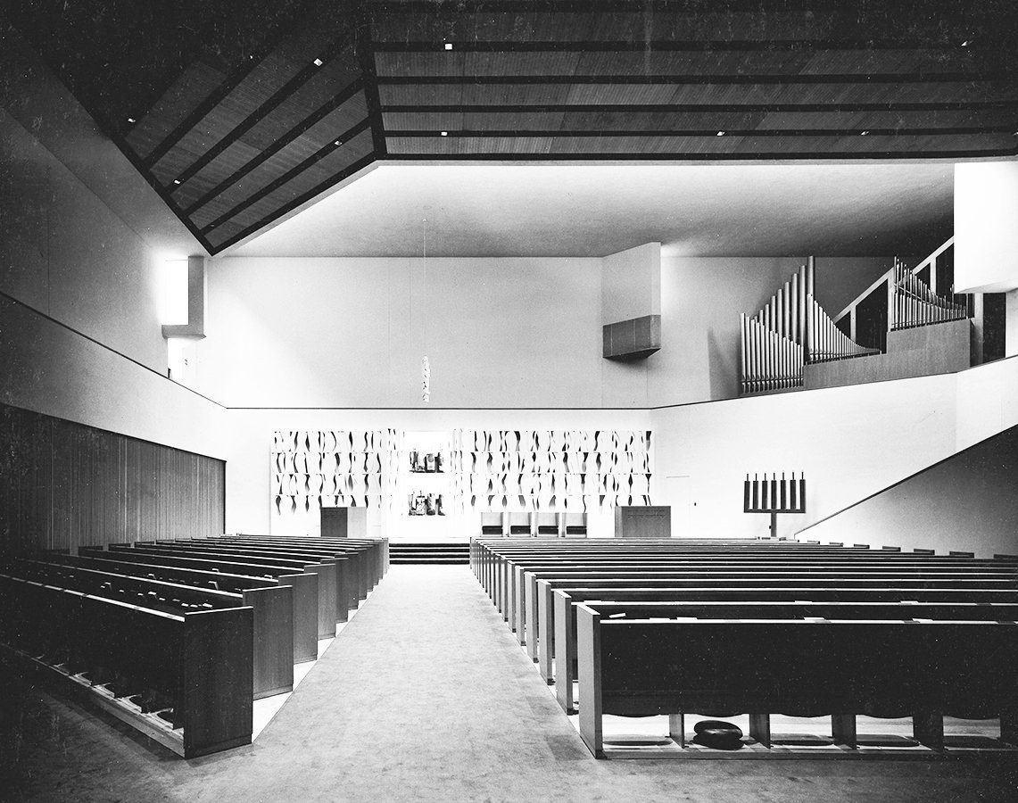 A black and white photo of the inside of a church