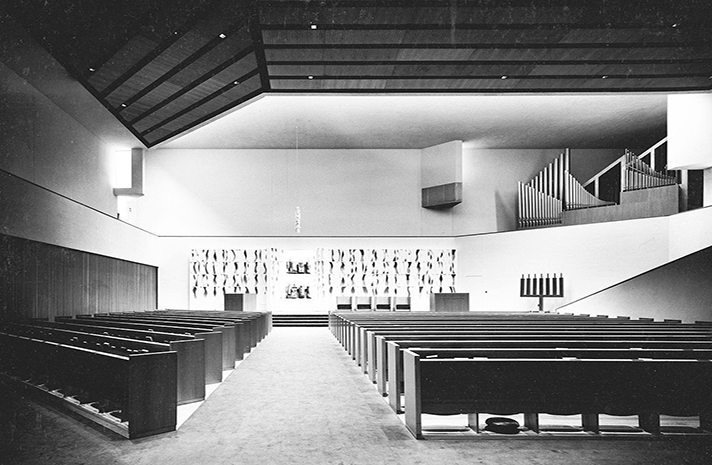 A black and white photo of the inside of a church
