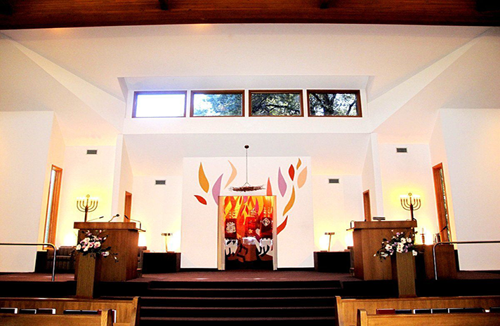 A church with a painting of flames on the wall
