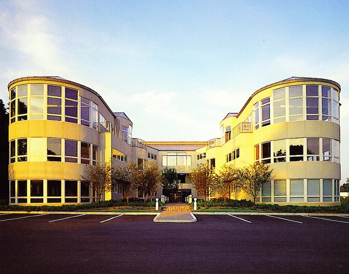 A large yellow building with a lot of windows