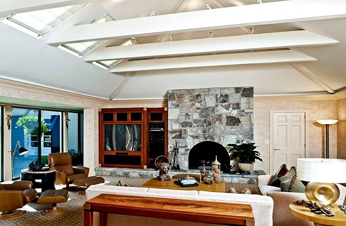 A living room with a fireplace and a couch