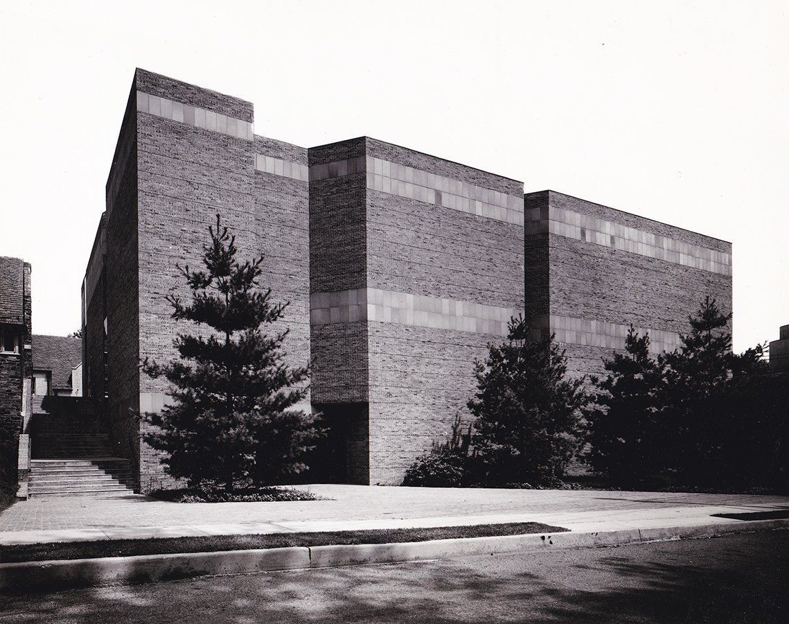 A black and white photo of a large brick building