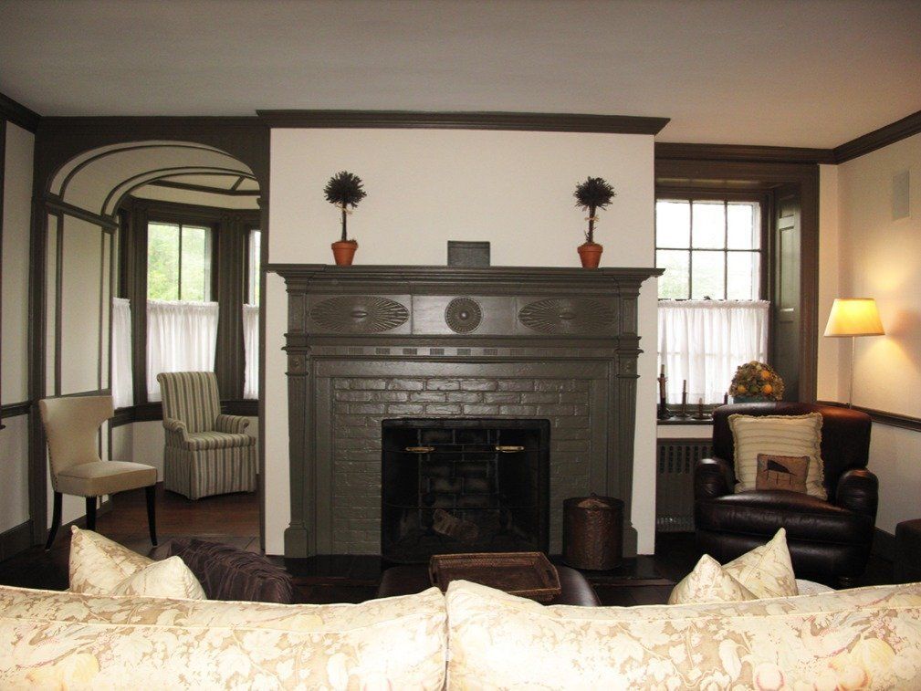 A living room with a fireplace and a couch