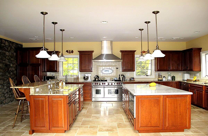 A large kitchen with wooden cabinets and stainless steel appliances