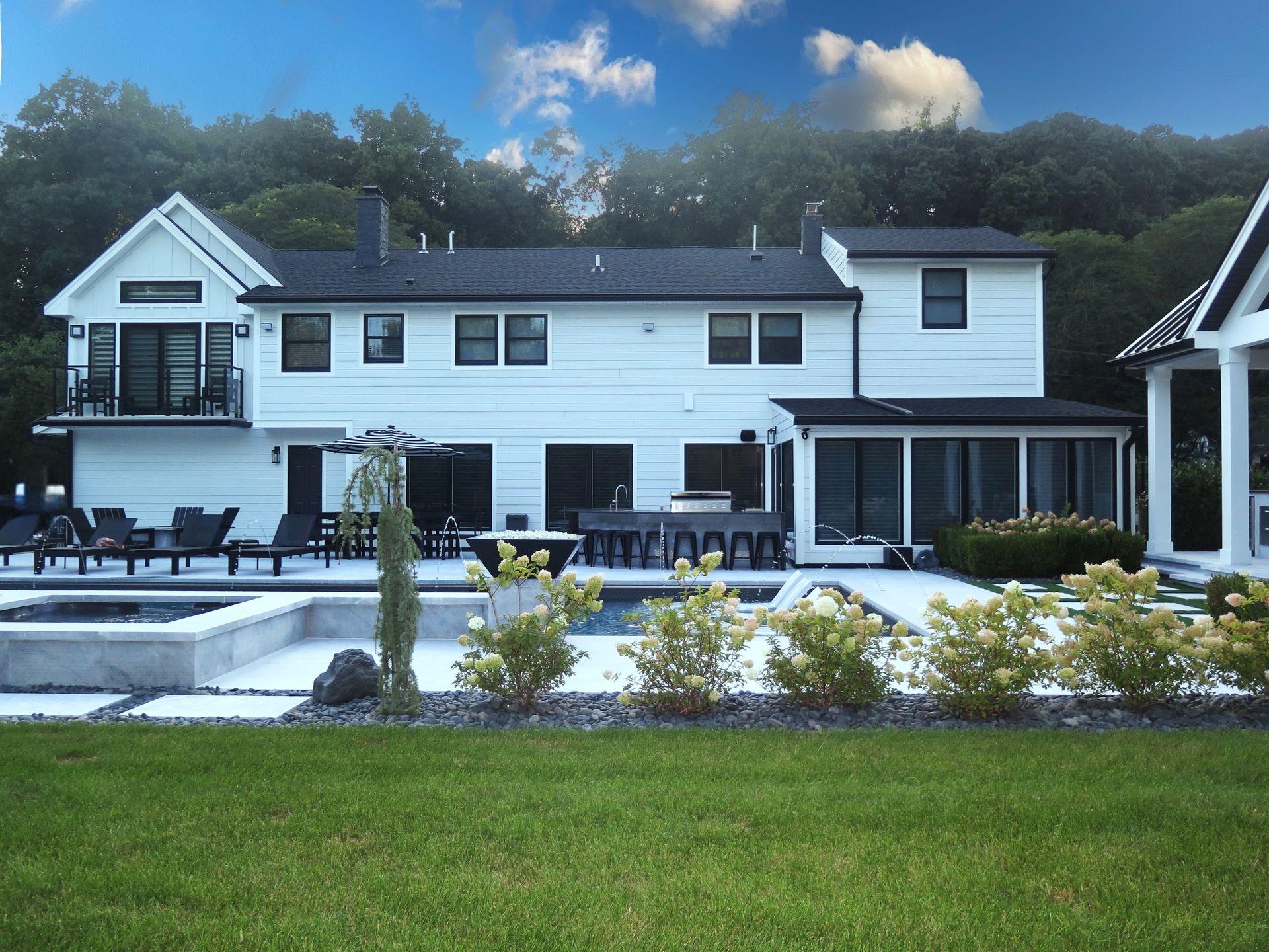 A dining room with a large wooden table and chairs