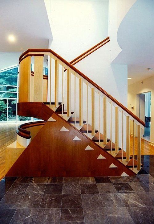 A wooden staircase with triangles on the steps