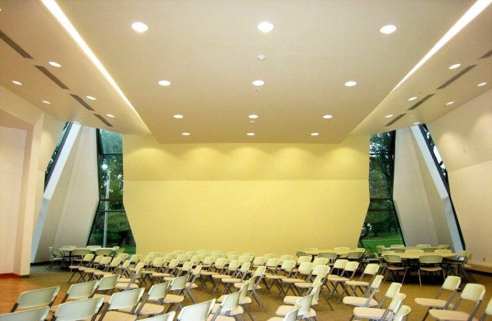 A large room with tables and chairs in it