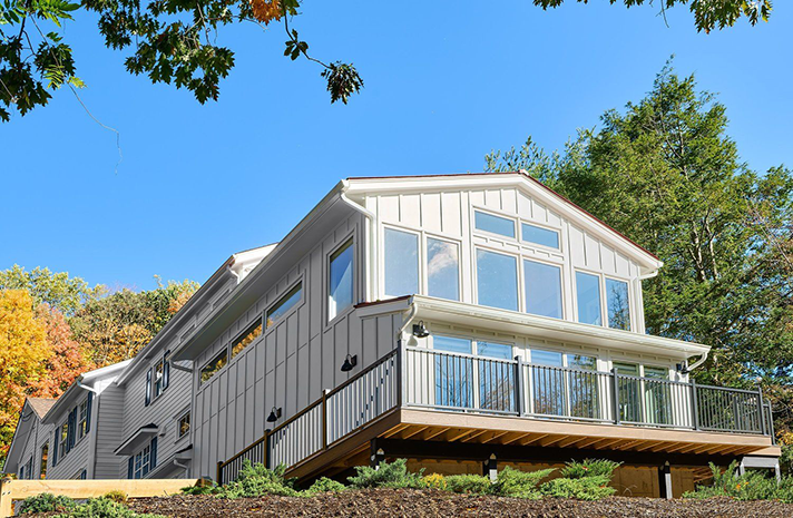 A large house with a lot of windows and a balcony