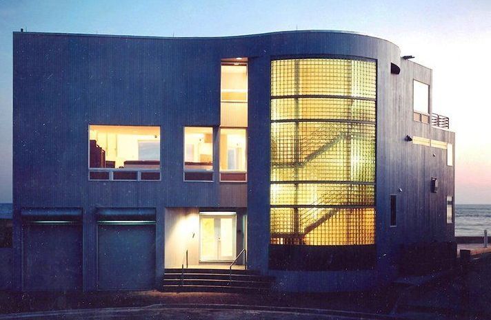 A large house with a lot of windows and stairs