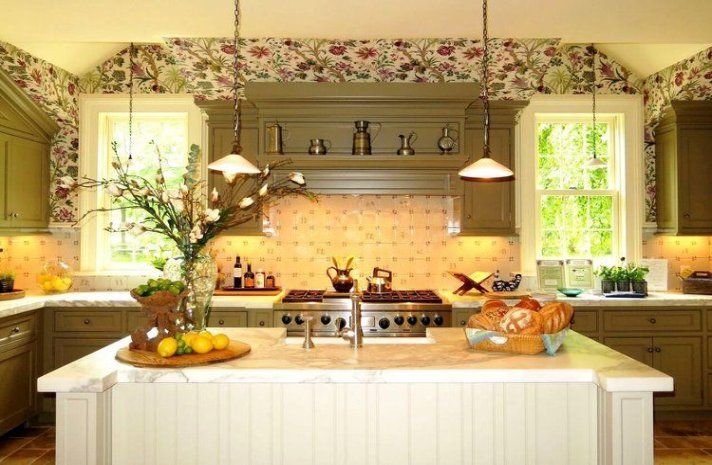 A kitchen with a large island and a stove top oven