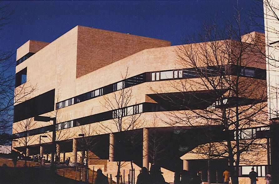 A large building with a blue sky in the background