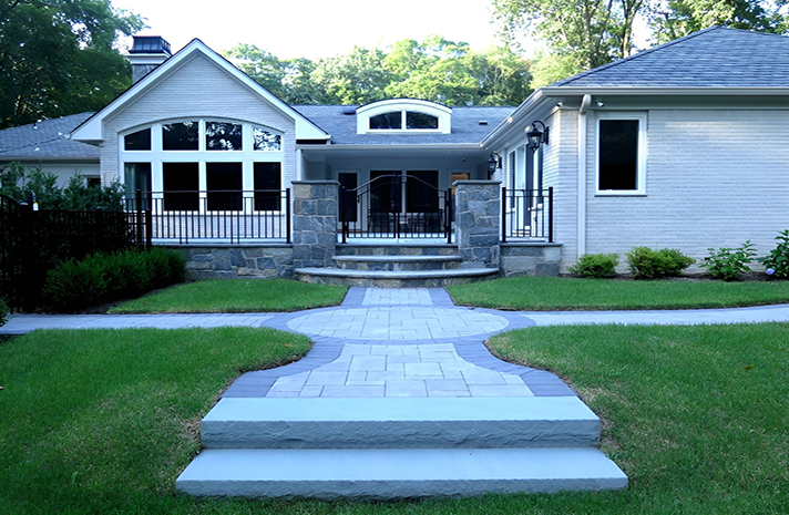 A white house with a walkway leading to it