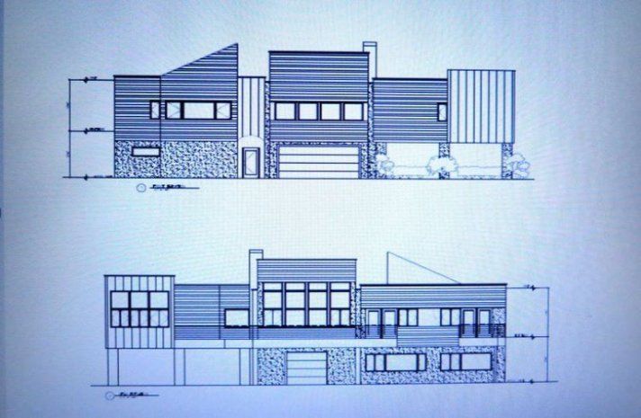 A black and white drawing of a house with a garage