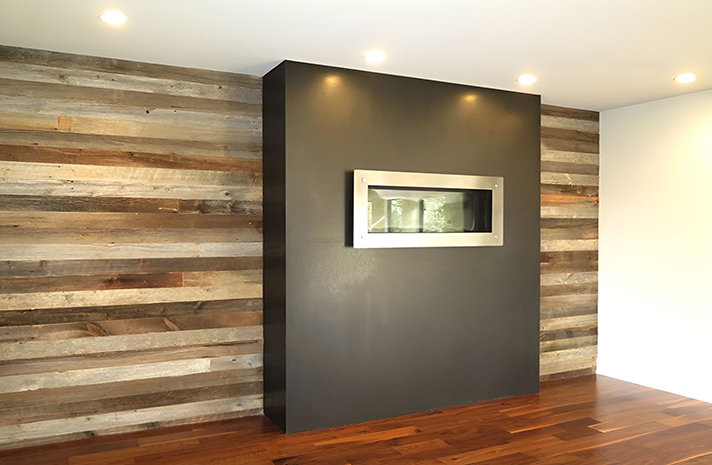 There is a fireplace in the middle of the room.