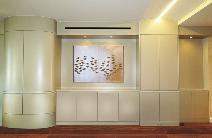 A room with a large painting on the wall