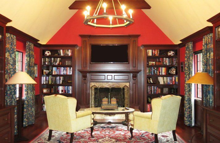 A living room with a fireplace and a flat screen tv