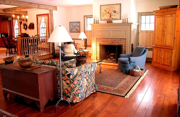 A living room filled with furniture and a fireplace