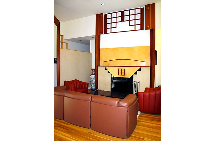 A living room with a fireplace and a couch