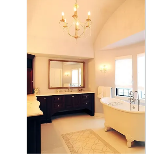 A bathroom with a claw foot tub and a large mirror