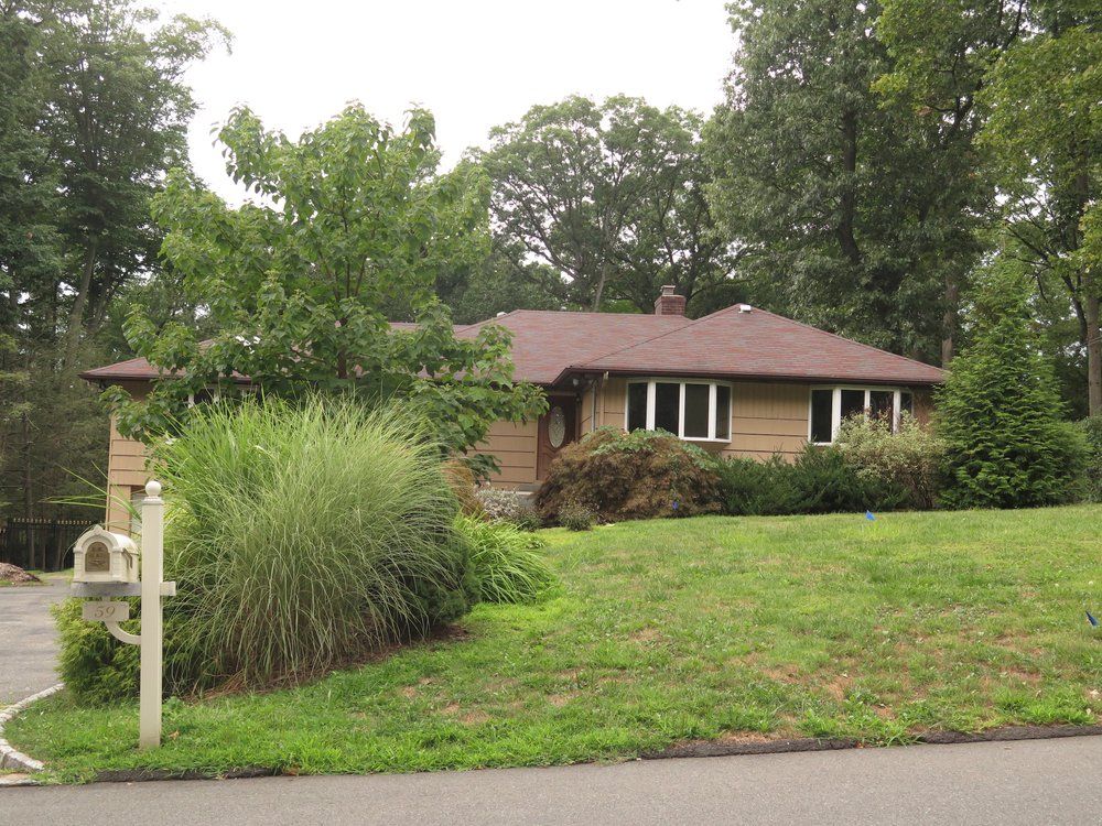 A house with a mailbox in front of it