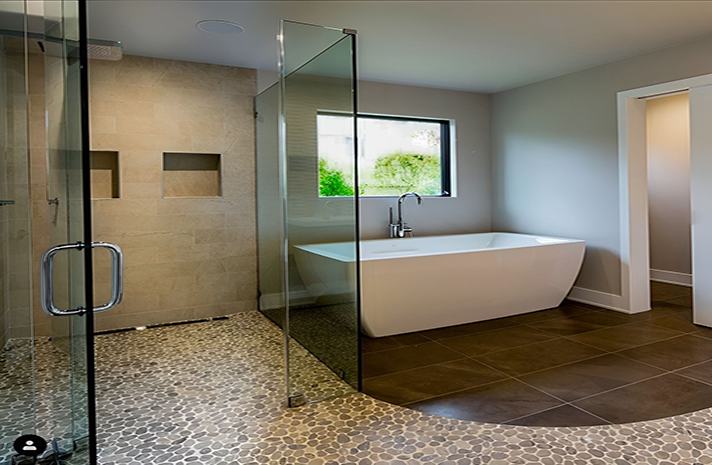 A bathroom with a tub , shower , and window.