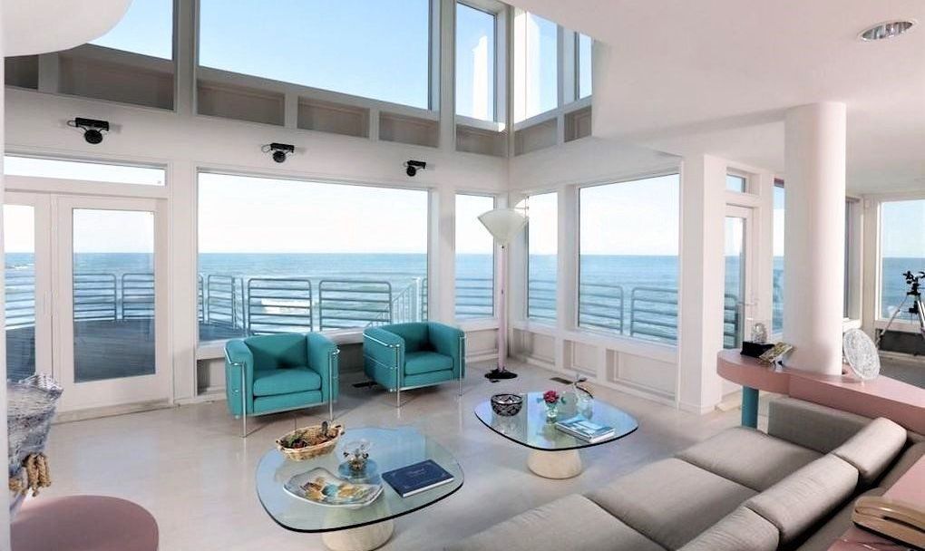 A living room with a view of the ocean