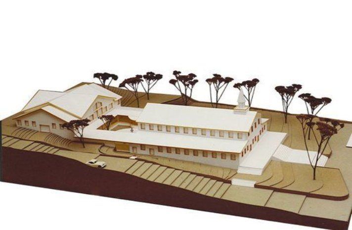 A model of a house with trees around it
