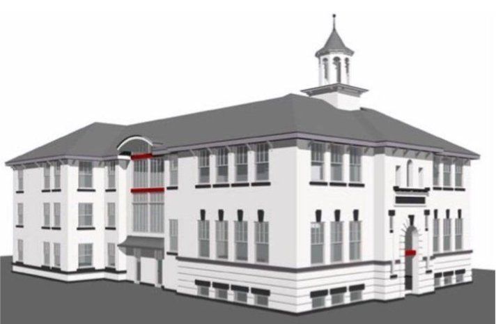 A large white building with a tower on top of it