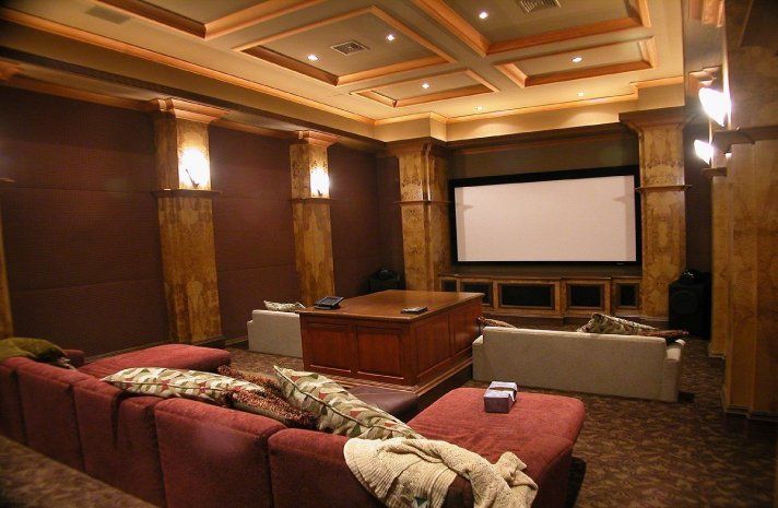 A home theater with a large screen and a couch