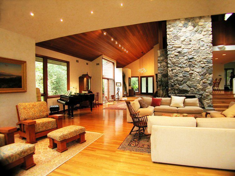 A living room filled with furniture and a piano