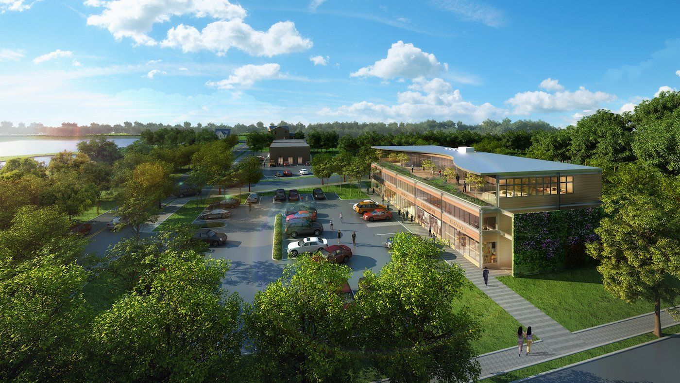 An aerial view of a large building surrounded by trees.