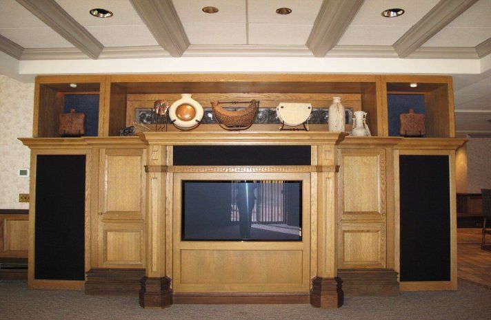 A wooden entertainment center with a flat screen tv