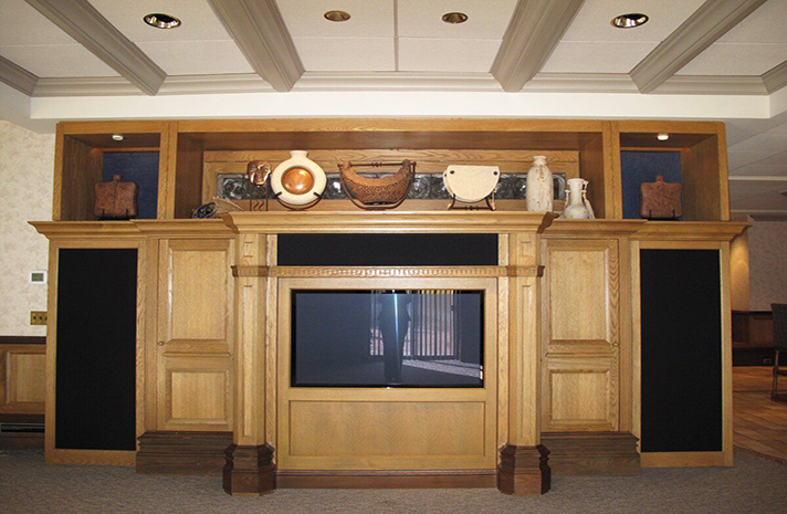 A wooden entertainment center with a flat screen tv