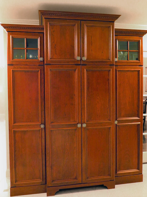 A row of wooden cabinets with glass doors