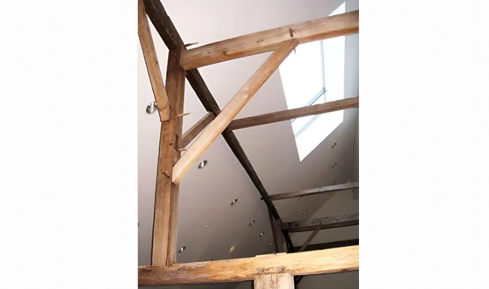 A wooden structure with a skylight in the ceiling