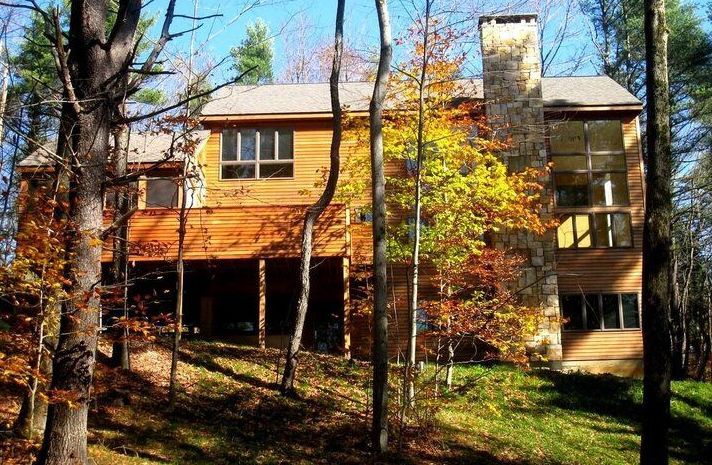 A large house in the middle of a forest