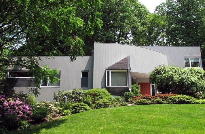 A living room with a couch a table and chairs
