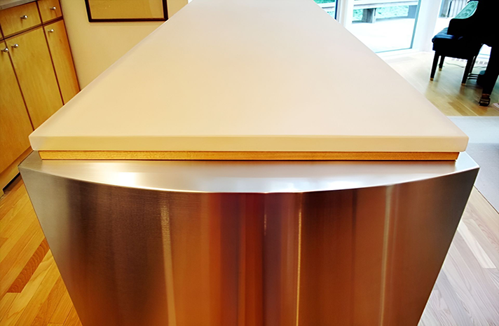 A stainless steel counter top with a white counter top