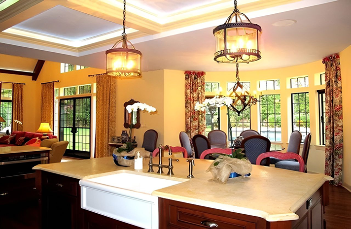 A kitchen with a large island and a sink