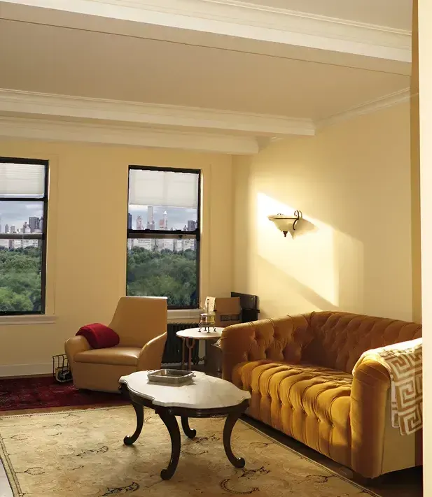 A living room with a couch a chair and a coffee table