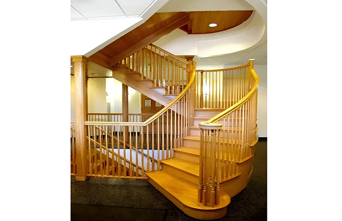 A spiral staircase made of wood in a building