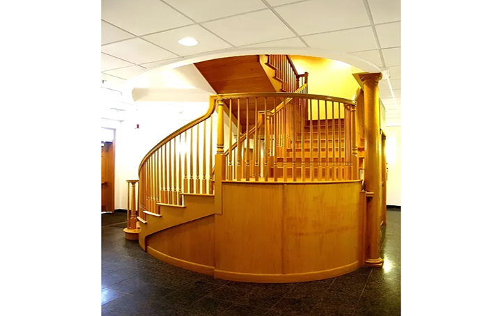 A wooden spiral staircase in a building