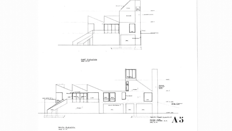 A black and white drawing of a house on a white background