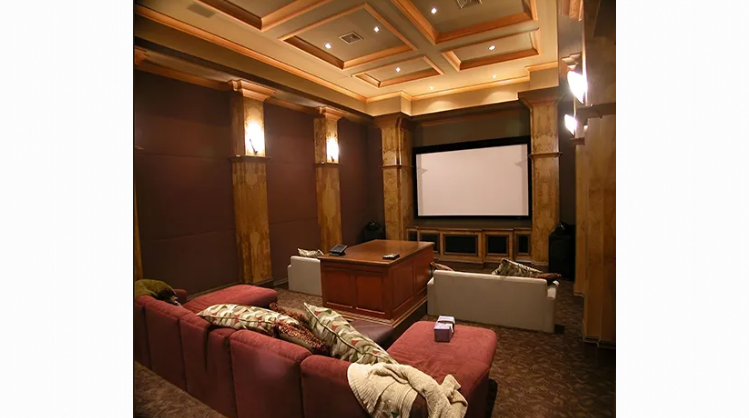 A home theater with a couch and a projector screen