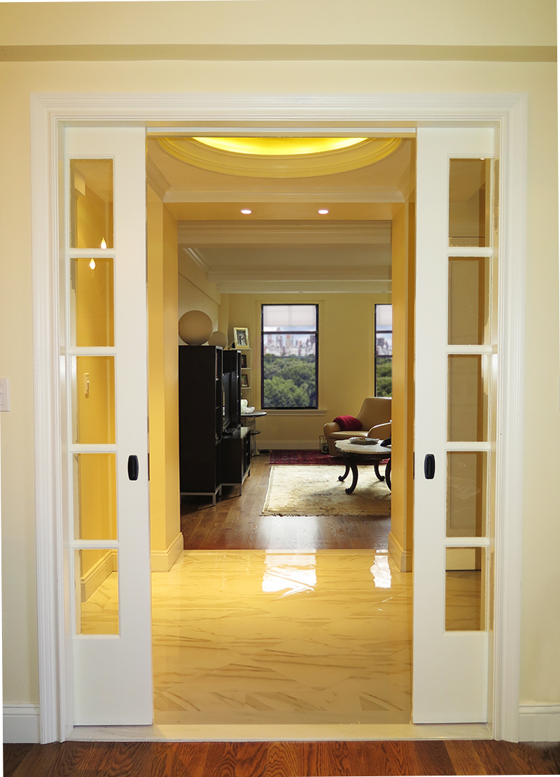 A sliding glass door opens to a living room