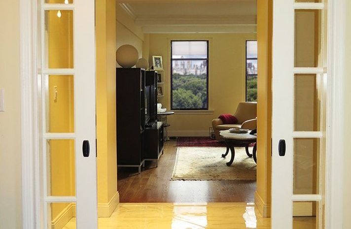 A living room with sliding glass doors leading to it