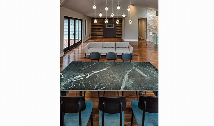 A living room with a marble table and chairs and a couch.